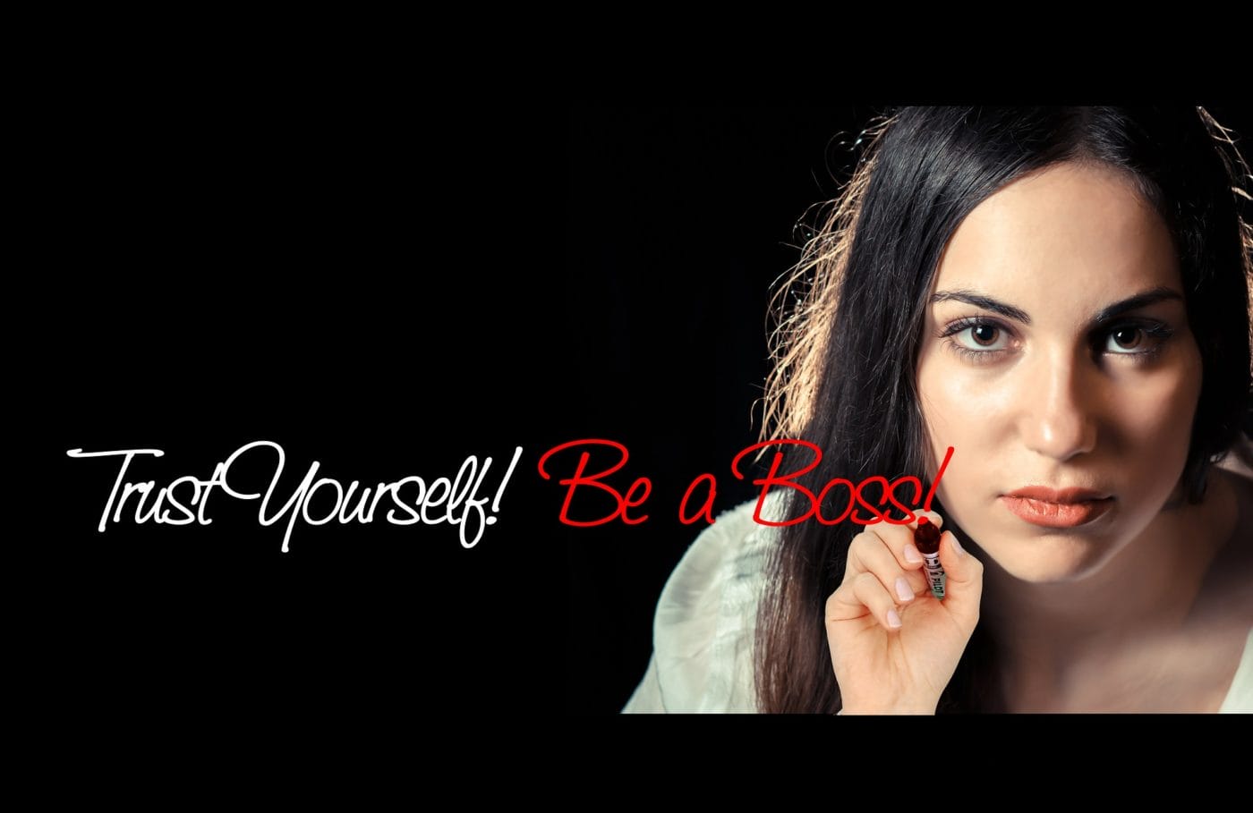 Woman looking at the screen saying "trust yourself be a boss"