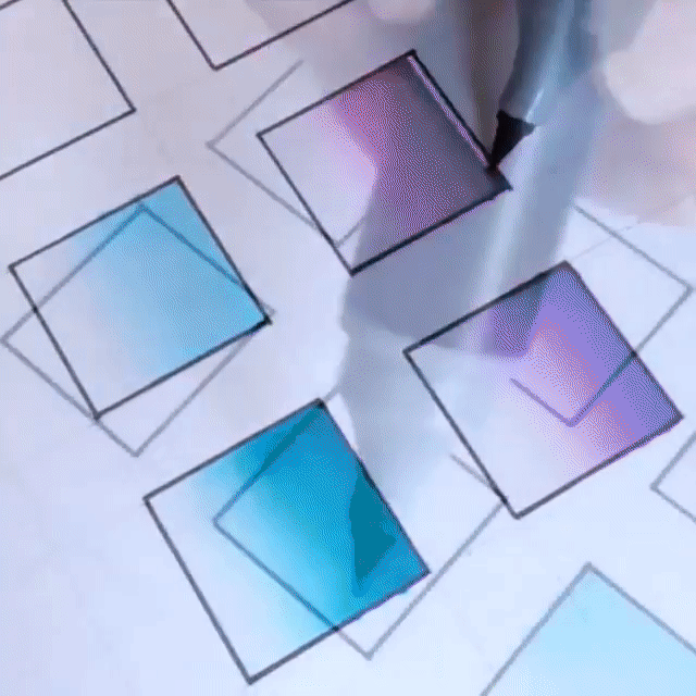 Purple, white and blue squares being drawn with a pen